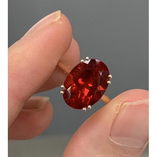 66 - A 14ct gold and red andesine ring, the Tarocco red andesine 4.3cts and 14x10mm, size S, 3.6g