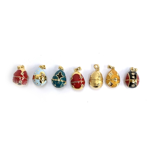 69 - A collection of seven Russian egg style 'Midas Renaissance Egg' silver and enamel pendants, each set... 