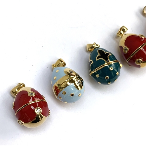 69 - A collection of seven Russian egg style 'Midas Renaissance Egg' silver and enamel pendants, each set... 