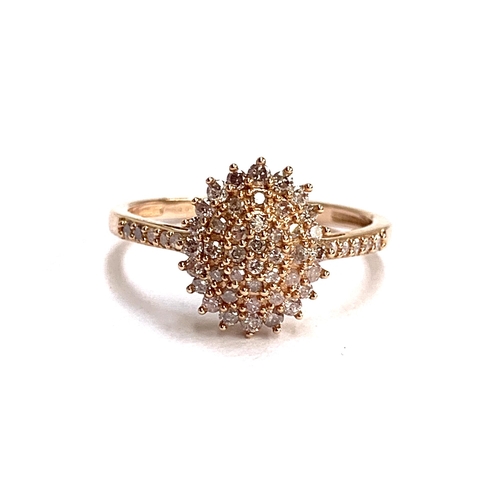 71 - A 9ct rose gold diamond cluster ring, size P, 2.3g