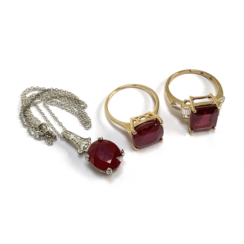 80 - Two 9ct gold ruby cocktail rings, 9.6g gross weight; together with a ruby pendant