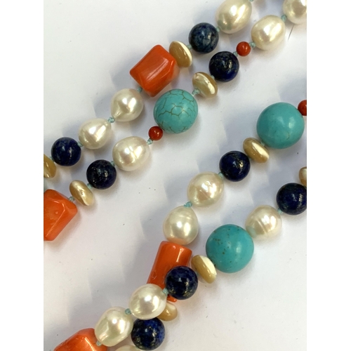 10 - An opera length lapis, cultured pearl, coral and mother of pearl bead necklace, 59cmL