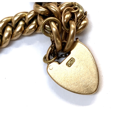 111 - An antique 9ct gold curb link bracelet with heart padlock clasp, stamped 9ct, 18.2g