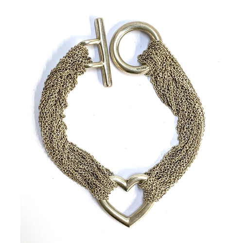 113 - A Tiffany & Co. silver multi strand heart bracelet, 18.5cmL, the clasp bar marked 'Tiffany & Co 925'... 