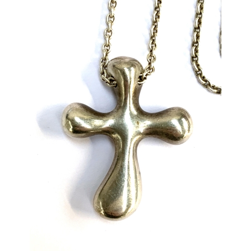 114 - An Elsa Peretti for Tiffany & Co. silver cross pendant on chain, the cross 3cmL, the chain with hall... 