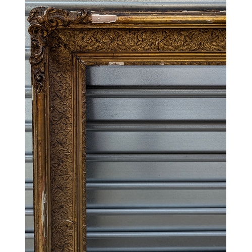 766 - An ornate gilt gesso frame, IR 85.5x71cm, total 101x88cm