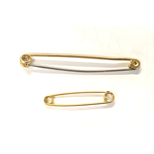 110 - Two 9ct gold stock pins, 4.3cmL and 7.5cmL, gross weight 6.8g