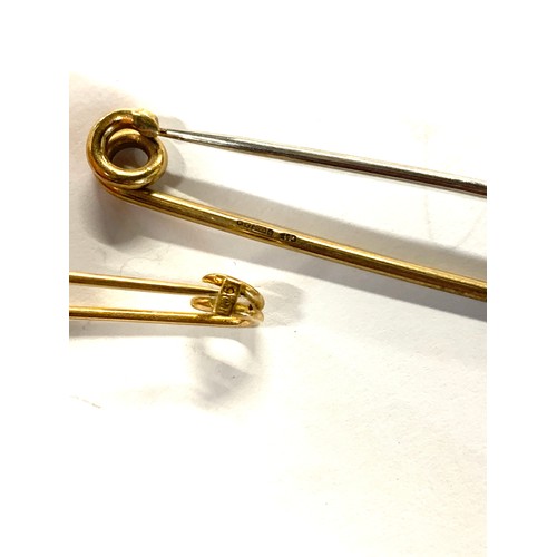 110 - Two 9ct gold stock pins, 4.3cmL and 7.5cmL, gross weight 6.8g