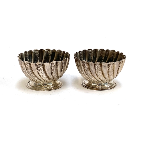 121 - A pair of late Victorian silver salts by Josiah Williams & Co, London 1894, spirally gadrooned on sm... 