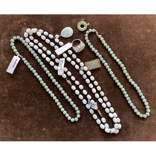 56 - A quantity of 925 silver mounted jade jewellery, to include pendants, beaded bracelets, necklaces et... 