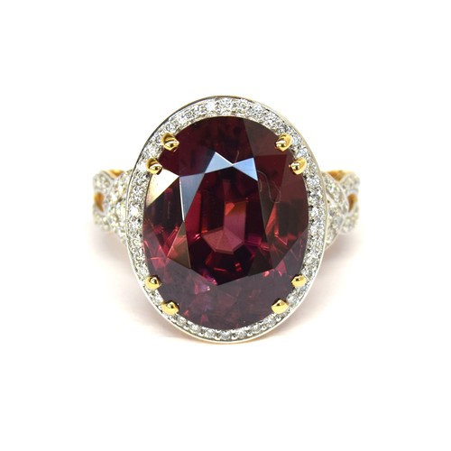 43A - An 18ct gold, red zircon and diamond ring, the large Ratanakiri red zircon 17.9cts and measuring 16x... 