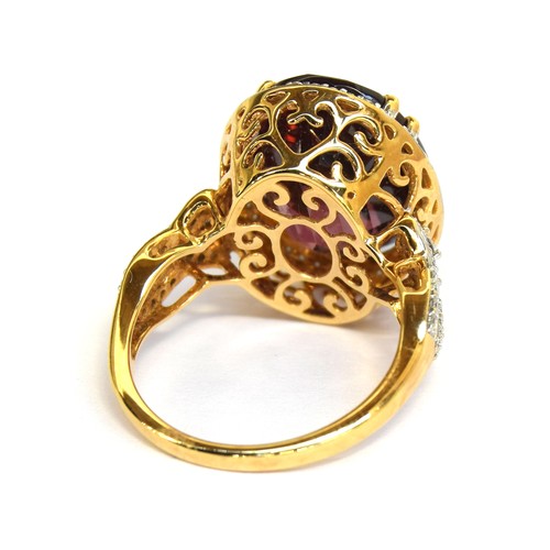 43A - An 18ct gold, red zircon and diamond ring, the large Ratanakiri red zircon 17.9cts and measuring 16x... 