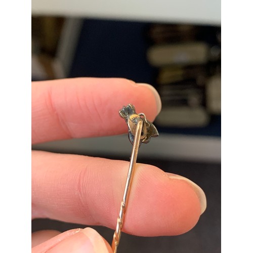 6 - A Victorian gold and silver stickpin in the form of a fly (af), set with rose cut diamonds, red past... 