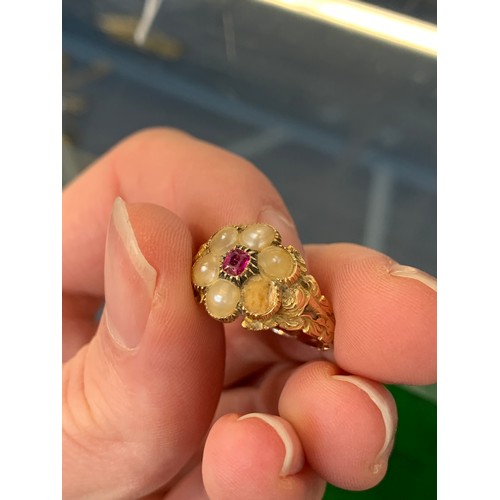 10 - A Georgian gold floral cluster ring set with split pearls and a central ruby (af), approx. size O, 3... 