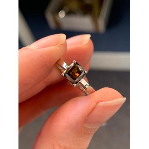 41B - An 18ct white gold argyle fancy brown diamond solitaire ring, the diamond weighing 1.6cts and measur... 