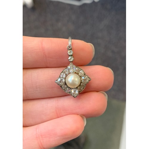 21 - A late Victorian silver mounted diamond and pearl pendant, the possibly natural pearl 7.5mm diameter... 