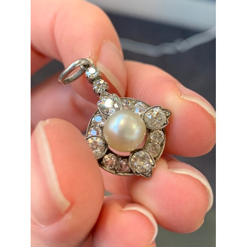 21 - A late Victorian silver mounted diamond and pearl pendant, the possibly natural pearl 7.5mm diameter... 