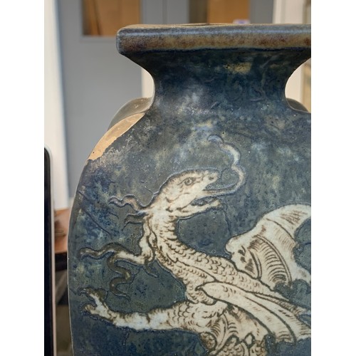 156 - A late Victorian Martin Brothers stoneware vase of tapering form (chipped), decorated with dragons o... 