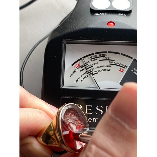 11 - A large and heavy Georgian gold mounted garnet intaglio portrait ring, the gold in two colours, the ... 