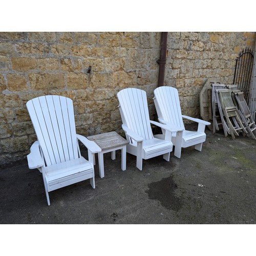 807 - Three white Adirondack chairs, 103cmH with footrests; together with a small garden side table