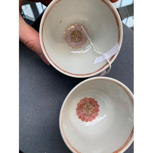 211 - A pair of Chinese famille rose 'Baragon Tumed' porcelain teabowls, decorated with leaf shaped cartou... 