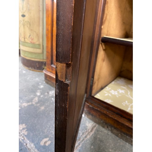 422 - A 19th century glazed breakfront bookcase, the moulded pediment over a four section glazed top, the ... 