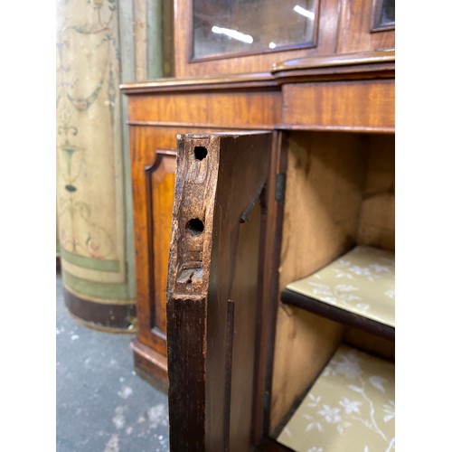 422 - A 19th century glazed breakfront bookcase, the moulded pediment over a four section glazed top, the ... 