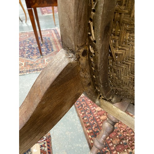 458 - A pair of early 20th century Indian teak planter's chairs, each approx. 64cm wide