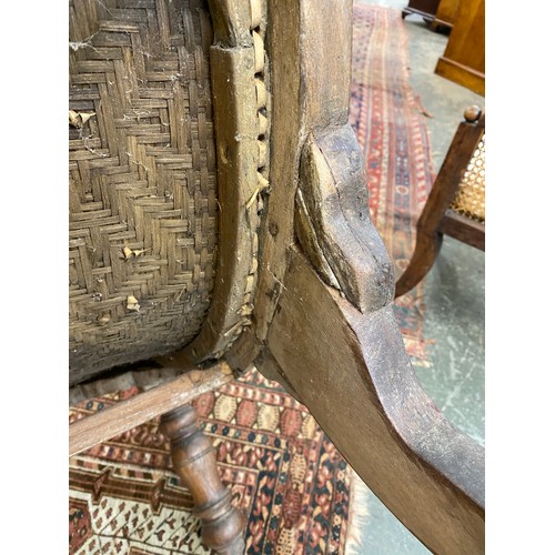 458 - A pair of early 20th century Indian teak planter's chairs, each approx. 64cm wide