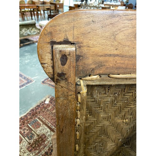 458 - A pair of early 20th century Indian teak planter's chairs, each approx. 64cm wide