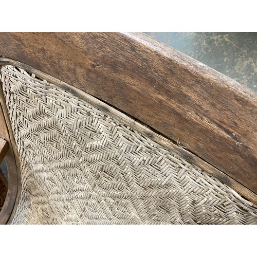 458 - A pair of early 20th century Indian teak planter's chairs, each approx. 64cm wide