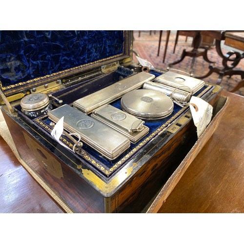 131 - A Victorian coromandel and brass mounted travelling toilet box, with flush brass handles and brass p... 