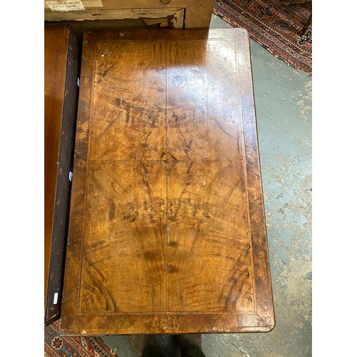 365 - An 18th century walnut kneehole dressing table, the quarter veneered feather banded top over seven d... 