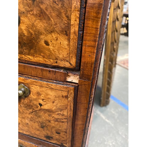 365 - An 18th century walnut kneehole dressing table, the quarter veneered feather banded top over seven d... 