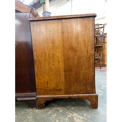 365 - An 18th century walnut kneehole dressing table, the quarter veneered feather banded top over seven d... 