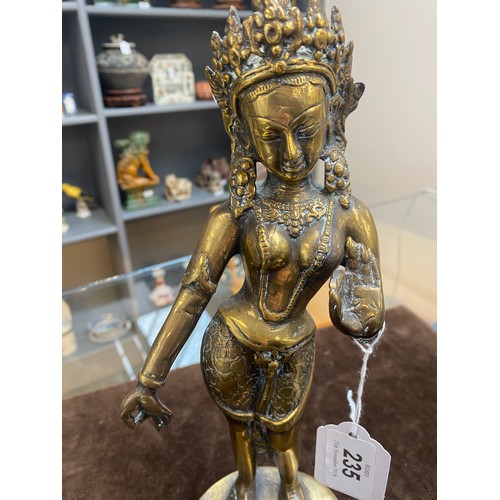 235 - A Tibetan brass figure of the goddess Tara, 30cm high