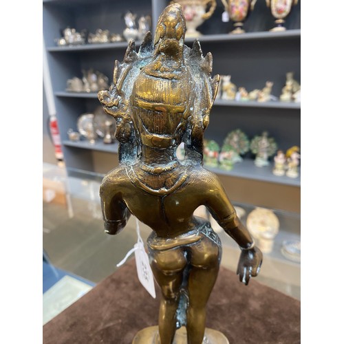 235 - A Tibetan brass figure of the goddess Tara, 30cm high