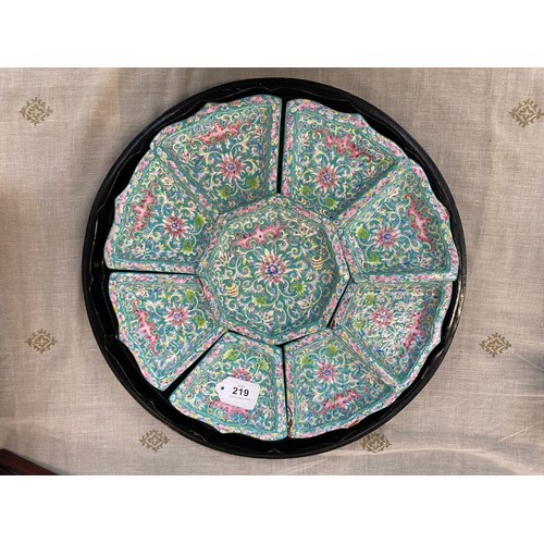 219 - A Chinese Canton enamel sweetmeat set, the nine enamelled dishes depicting pink florals on a turquoi... 