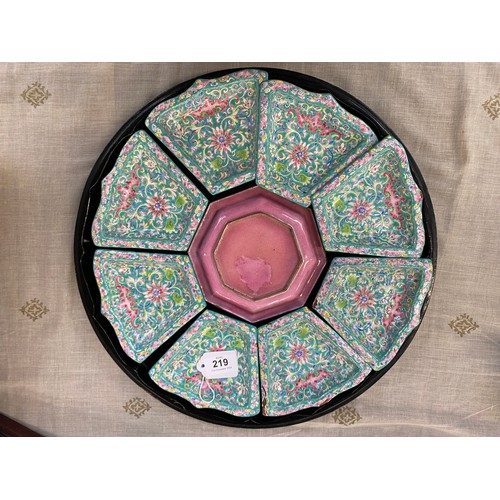 219 - A Chinese Canton enamel sweetmeat set, the nine enamelled dishes depicting pink florals on a turquoi... 