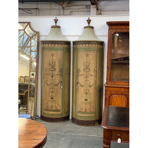 383 - A pair of 19th century demilune pier cabinets, pavilion style tops with gilt urn cresting, painted w... 