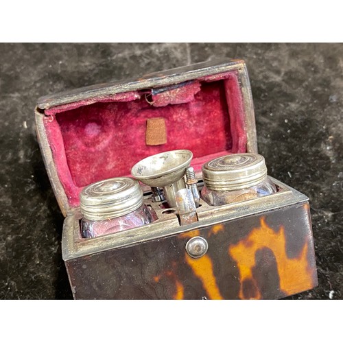 134 - A 19th century miniature tortoiseshell travel inkwell, fitted interior with cut glass bottles and pe... 