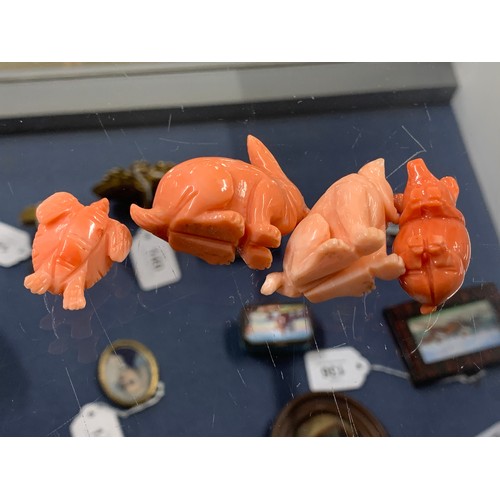 129 - Four carved coral animals, rabbit, dog, turtle and pig, the largest 3.5cm high