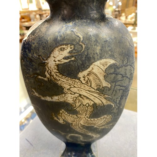 156 - A late Victorian Martin Brothers stoneware vase of tapering form (chipped), decorated with dragons o... 