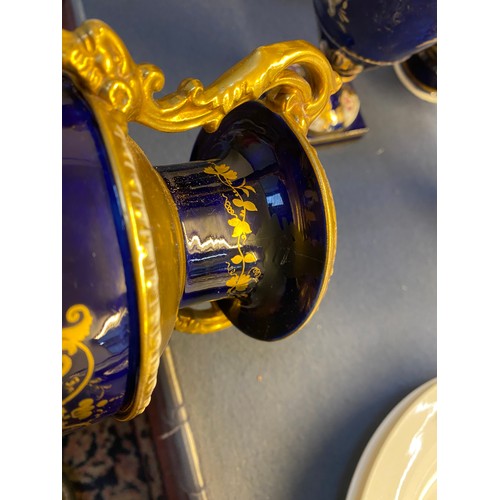 192 - A collection of eleven 19th century cobalt blue and gilt vases, various conditions, hand painted wit... 