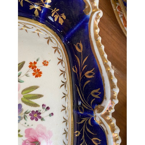 193 - A set of twelve 19th century cobalt blue and gilt dessert plates, each with central hand painted flo... 