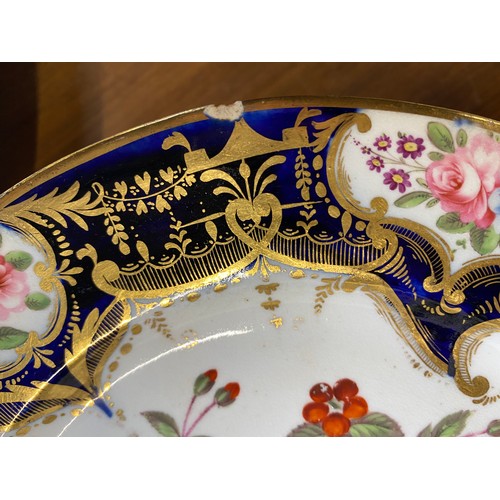 193 - A set of twelve 19th century cobalt blue and gilt dessert plates, each with central hand painted flo... 