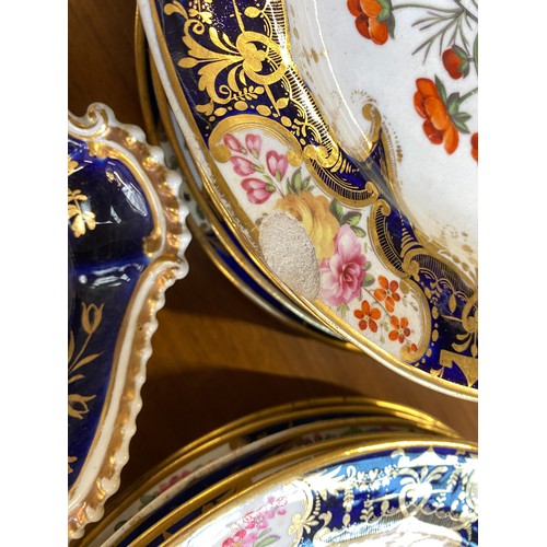 193 - A set of twelve 19th century cobalt blue and gilt dessert plates, each with central hand painted flo... 