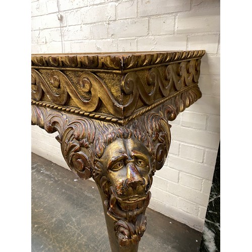 380 - An 18th century side table in the manner of Matthias Lock, serpentine marble top, over a giltwood fr... 