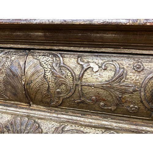 379 - An 18th century Italian gilt gesso console table, the top worked in low relief, over two slides and ... 