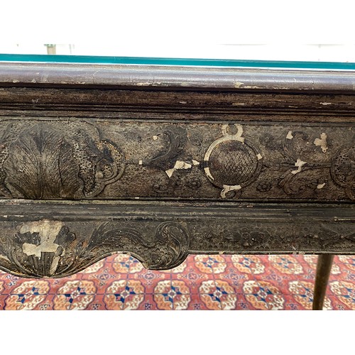 379 - An 18th century Italian gilt gesso console table, the top worked in low relief, over two slides and ... 